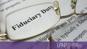 glasses with the words fiduciary duty in the lense on a piece of paper