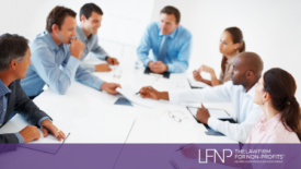 Proper Notice for Board and Member Meetings: Why It Matters and How to Do It Right - People joined around the table in a board meeting - Law Firm For Nonprofits