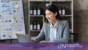 Nonprofit professional reviewing financial reports to maintain public charity status and meet IRS compliance requirements