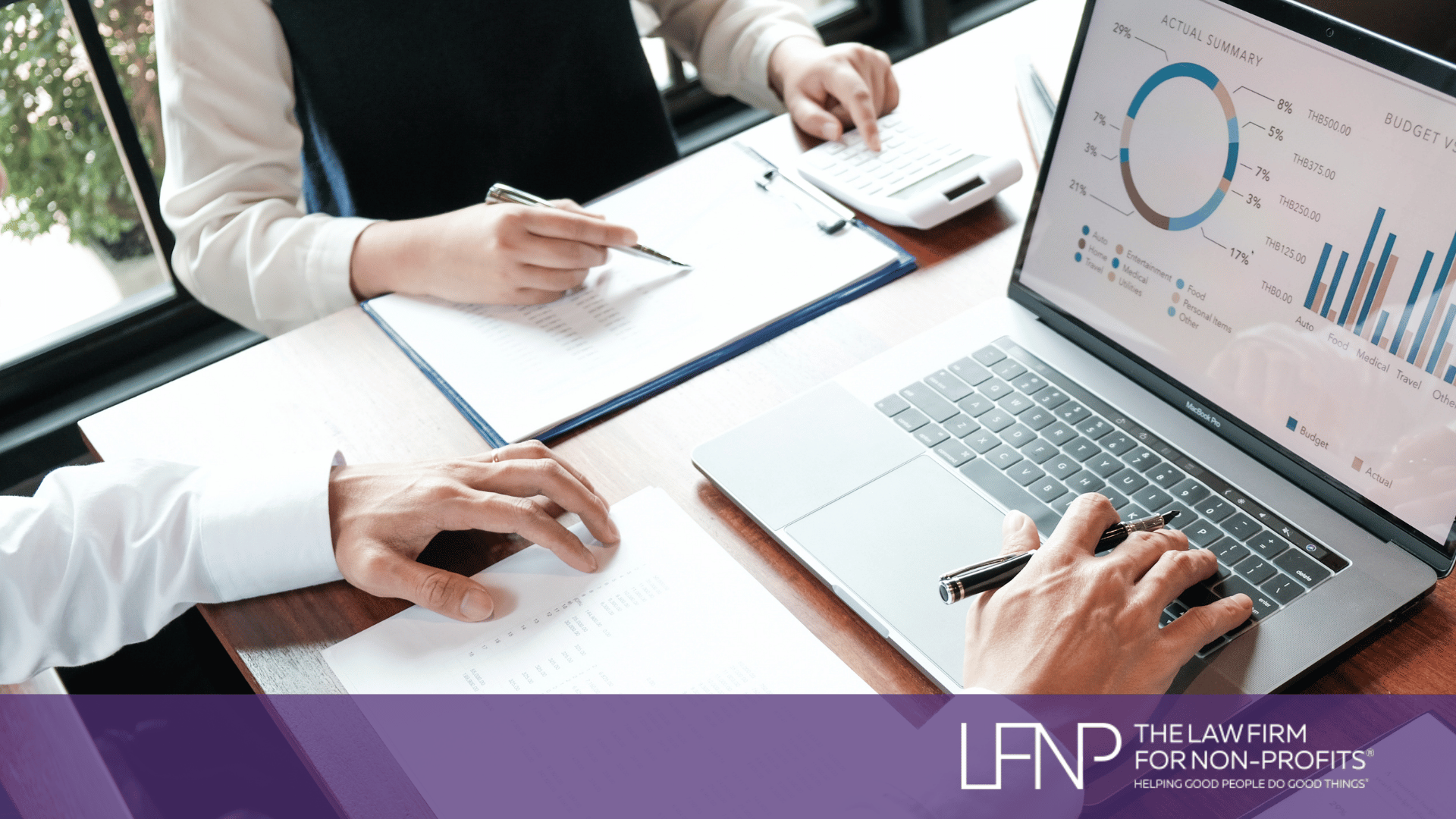 Two nonprofit professionals review financial reports and budget charts on a laptop while discussing public charity compliance and IRS reporting requirements. LFNP branding displayed at bottom of image.